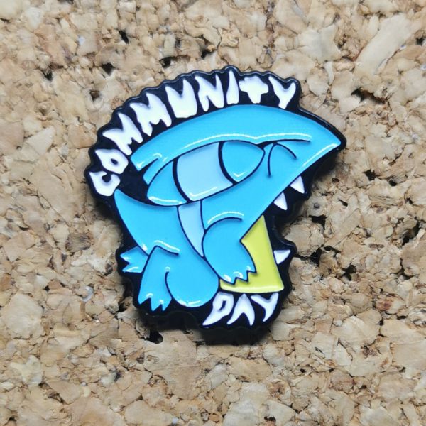 The shiny version of the June 2021 Community Day pin featuring Gible